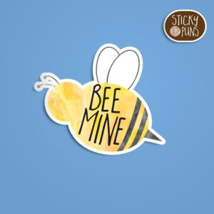 A pun sticker with the phrase 'BEE mine' featuring a charming bumblebee. Sticker is on a blue background with a sticky puns logo in the top right corner.