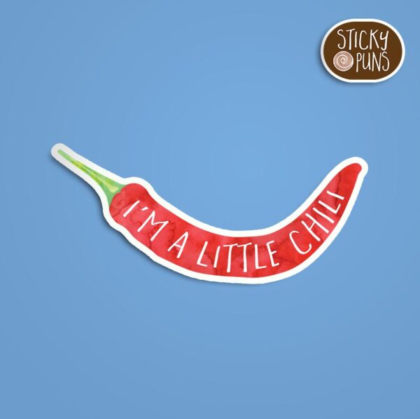 A pun sticker with the phrase 'I'm a little CHILI' written on a chili pepper.  Sticker is on a blue background with a sticky puns logo in the top right corner.