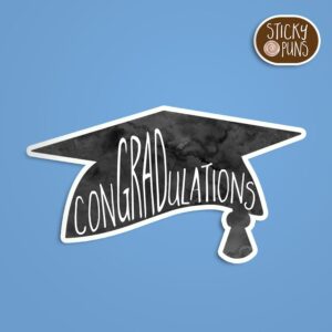 A pun sticker with the word 'ConGRADulations' written on a graduation cap.  Sticker is on a blue background with a sticky puns logo in the top right corner.