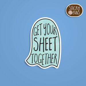 A pun sticker with the phrase 'Get your SHEET together' written on a ghost.  Sticker is on a blue background with a sticky puns logo in the top right corner.