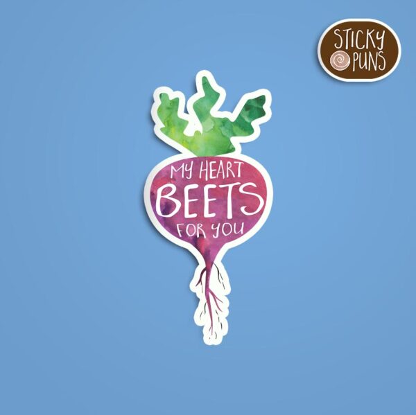 A pun sticker with the phrase 'My heart beets for you' written on a beet