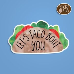 A pun sticker with the phrase 'Let's taco bout you' written on a taco shell.  Sticker is on a blue background with a sticky puns logo in the top right corner.