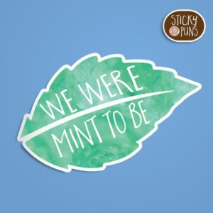 A pun sticker with the phrase 'We were mint to be' written on a mint leaf.