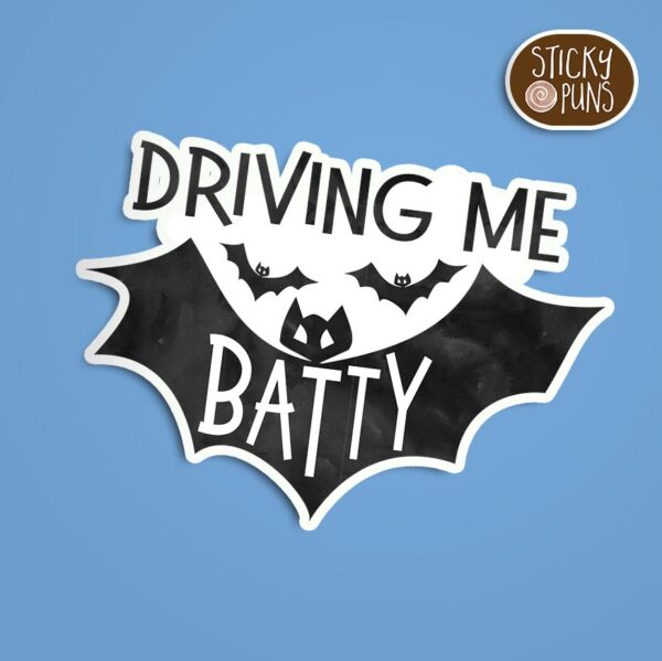 A pun sticker with the phrase 'driving me BATTY' featuring a bat.  Sticker is on a blue background with a sticky puns logo in the top right corner.