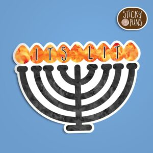 A Hanukkah pun sticker with the phrase 'It's lit' written in the flames of a menorah. Sticker is on a blue background with a sticky puns logo in the top right corner.