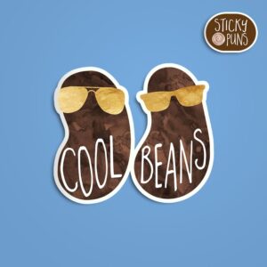 A pun sticker with the phrase 'Cool beans' written on a couple of beans wearing gold sunglasses. Sticker is on a blue background with a sticky puns logo in the top right corner.