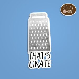 A pun sticker with the phrase 'That's grate' written on a cheese grater, adding humor to kitchen décor. Sticker is on a blue background with a sticky puns logo in the top right corner.