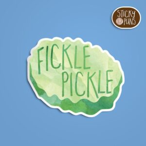 A fun pun sticker with the phrase 'Fickle Pickle' written on a pickle slice, a delightful gift for pickle or pickleball enthusiasts. Sticker is on a blue background with a sticky puns logo in the top right corner.