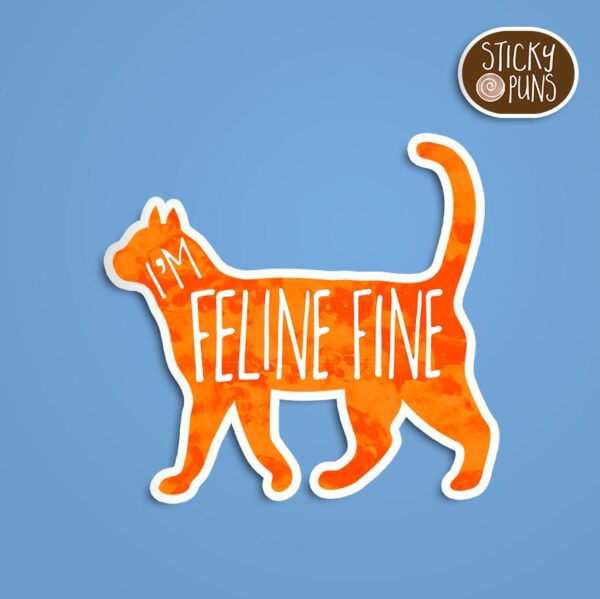 A pun sticker with the phrase 'FELINE fine' featuring a cute cat. Sticker is on a blue background with a sticky puns logo in the top right corner.