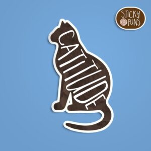A pun sticker with the word 'CATitude' and a cute cat. Sticker is on a blue background with a sticky puns logo in the top right corner.