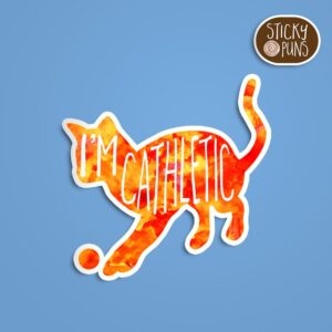 A pun sticker with the phrase 'I'm CAThletic' featuring an athletic cat. Sticker is on a blue background with a sticky puns logo in the top right corner.