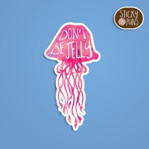 A pun sticker with the phrase 'don't be jelly' featuring a jellyfish. Sticker is on a blue background with a sticky puns logo in the top right corner.