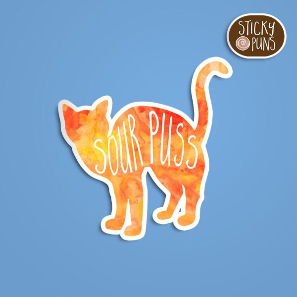 A pun sticker featuring a cat with the word 'sourpuss.' Sticker is on a blue background with a sticky puns logo in the top right corner.