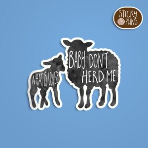 A pun sticker with the phrase 'What is love? Baby don't herd me' featuring a group of sheep. Sticker is on a blue background with a sticky puns logo in the top right corner.