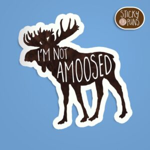 A pun sticker with the phrase 'I'm not amoosed' written on a moose.  Sticker is on a blue background with a sticky puns logo in the top right corner.