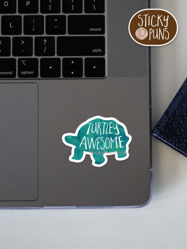 Turtley awesome - tortoise pun sticker shown stuck on a laptop