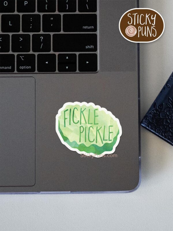 fickle pickle pun sticker shown stuck on a laptop