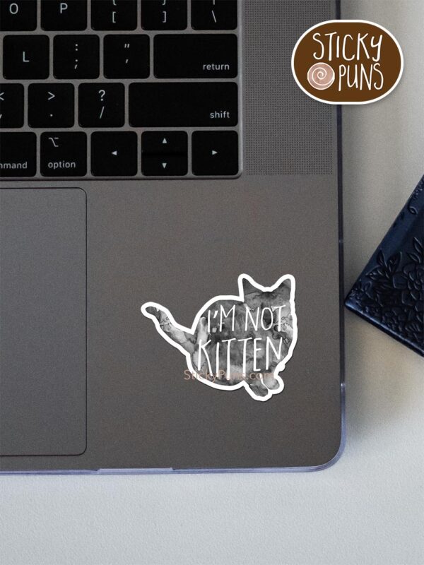 I'm not KITTEN - cute kitten pun sticker shown stuck on a laptop