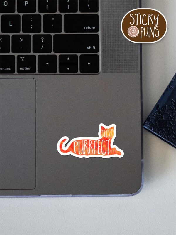 Just PURRfect- cute cat pun sticker shown stuck on a laptop