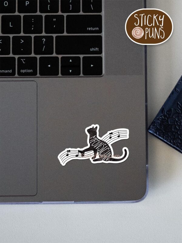 MEOWsician pun sticker shown stuck on a laptop