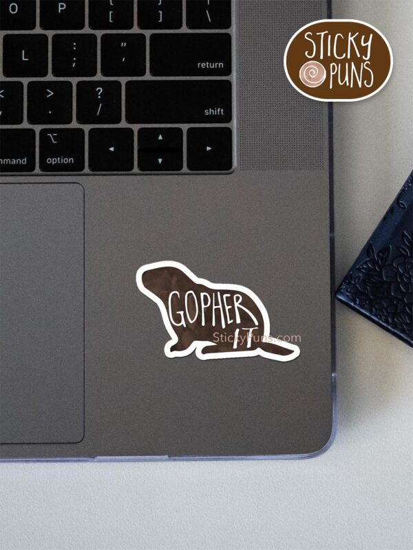 gopher it pun sticker shown stuck on a laptop