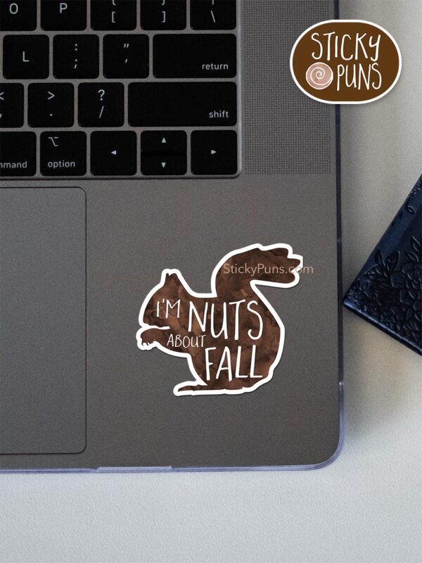 I'm NUTS About Fall pun sticker shown stuck on a laptop