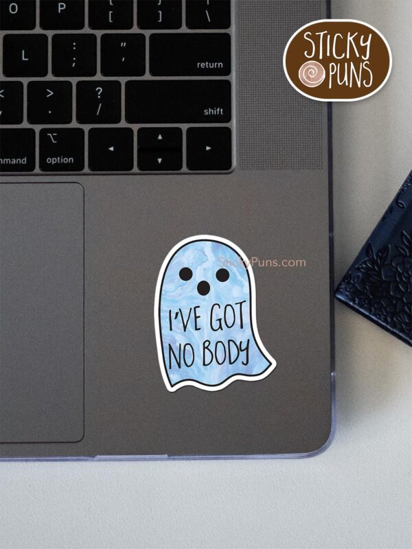 I've Got No BODY pun sticker shown stuck on a laptop