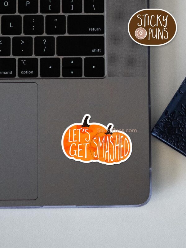 Let's get SMASHED - funny pumpkin pun sticker shown stuck on a laptop