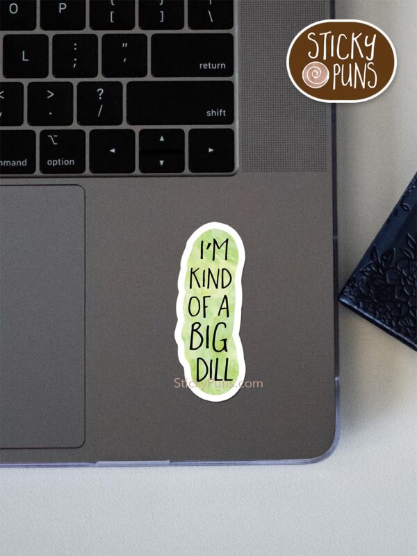 big dill pun sticker shown stuck on a laptop