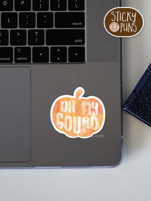 Oh my GOURD - funny pumpkin pun sticker shown stuck on a laptop