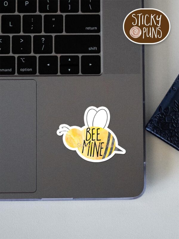 BEE mine sticker -pun sticker shown stuck on a laptop