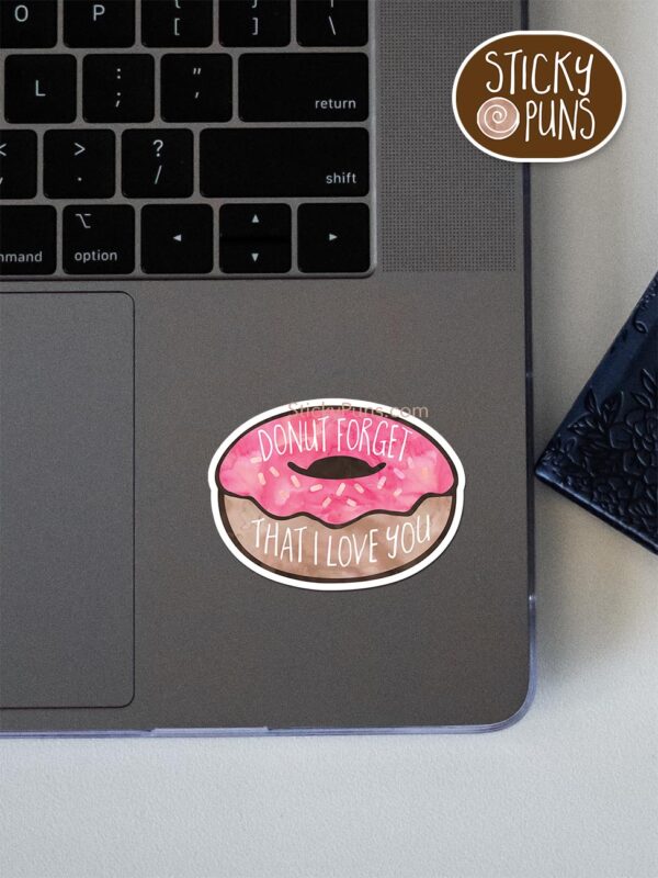 DONUT Forget That I Love You pun sticker shown stuck on a laptop