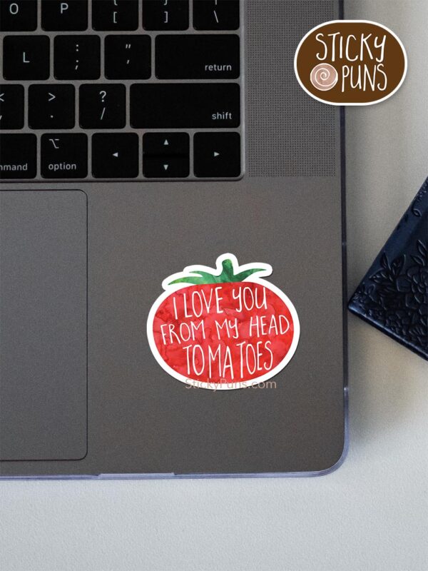 I love you from my head TOMATOES pun sticker shown stuck on a laptop