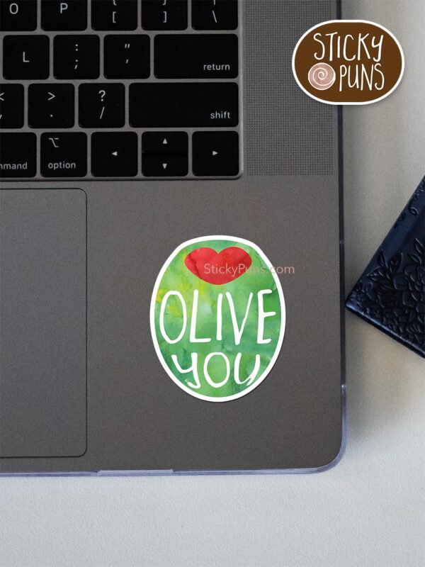 OLIVE you pun sticker shown stuck on a laptop