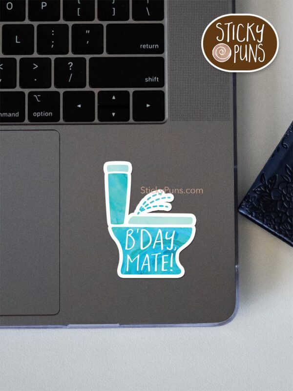 B'day, Mate! pun sticker shown stuck on a laptop