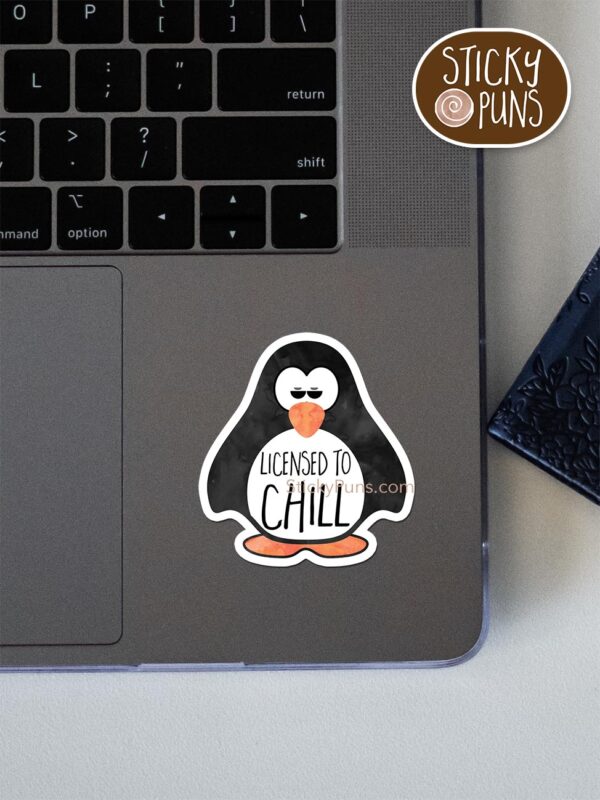 Licensed to CHILL pun sticker shown stuck on a laptop