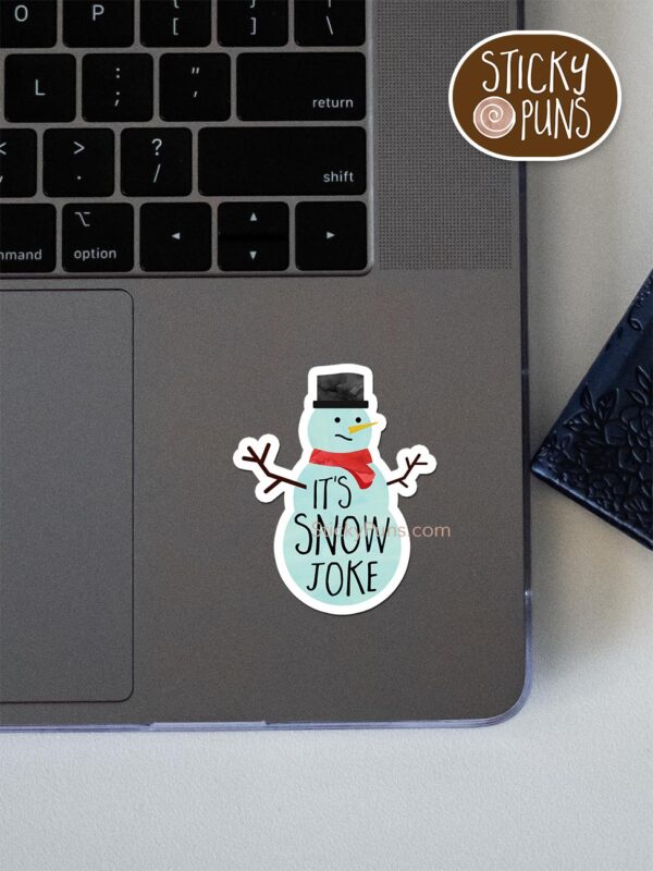 It's SNOW Joke pun sticker shown stuck on a laptop