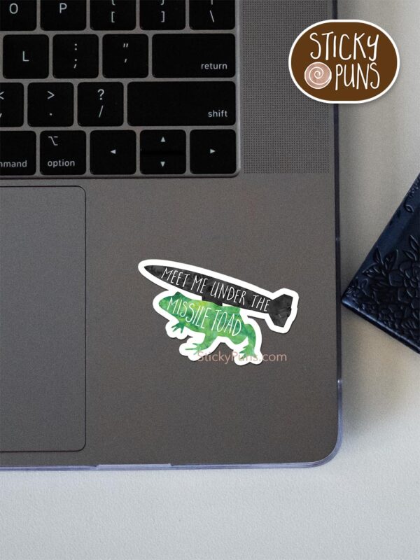 meet me under the missile toad pun sticker shown stuck on a laptop