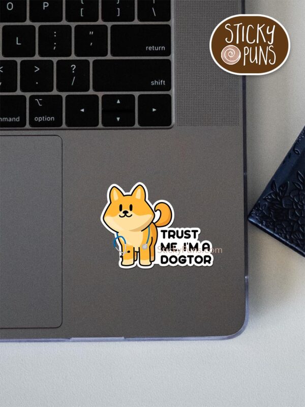 Trust me, I'm a DOGtor - veterinarian pun sticker pun sticker shown stuck on a laptop