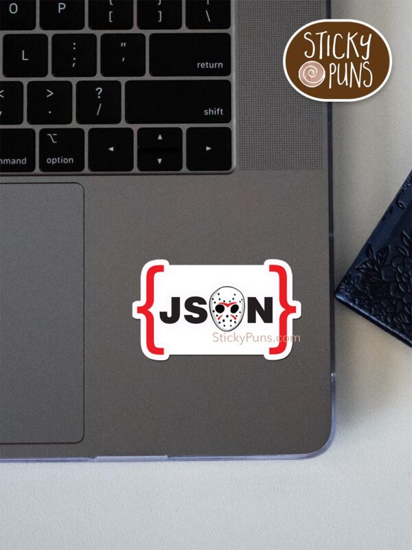 JSON - Jason Voorhees programming pun sticker shown stuck on a laptop