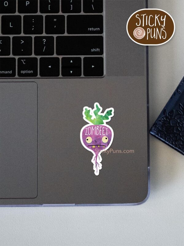 'ZomBEET' zombie beet pun sticker shown stuck on a laptop