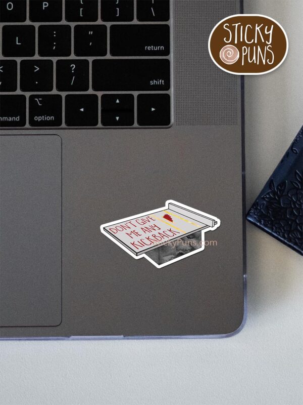 Don't give me any KICKBACK pun sticker shown stuck on a laptop