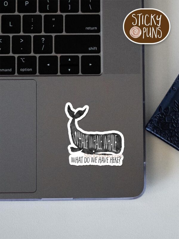 whale whale whale pun sticker shown stuck on a laptop