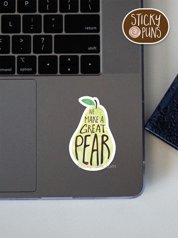 we make a great pear pun sticker shown stuck on a laptop