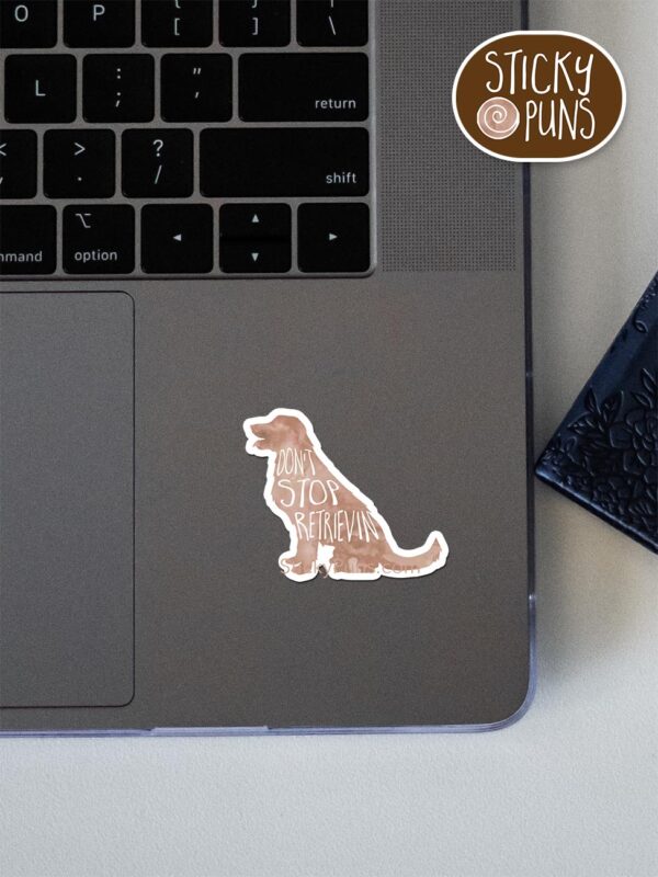 golden retriever pun sticker shown stuck on a laptop