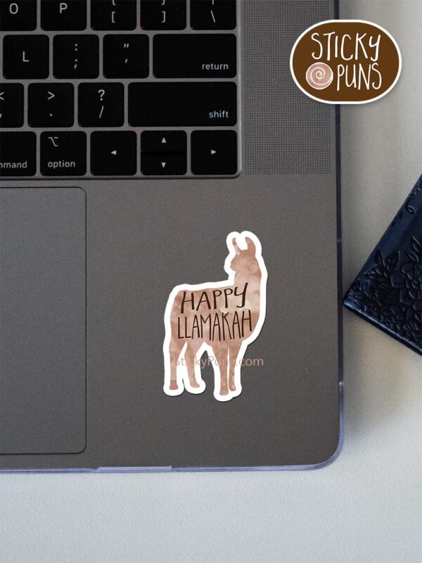 Happy LLamakah pun sticker shown stuck on a laptop