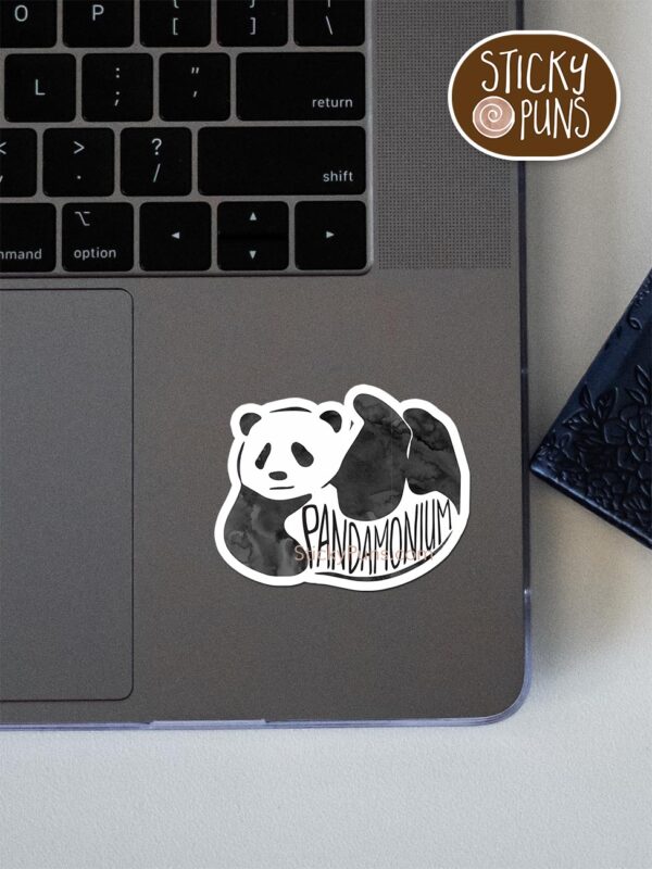 pandamonium pun sticker shown stuck on a laptop