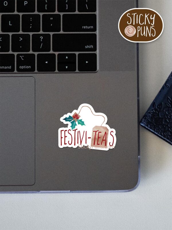 festiviteas pun sticker shown stuck on a laptop