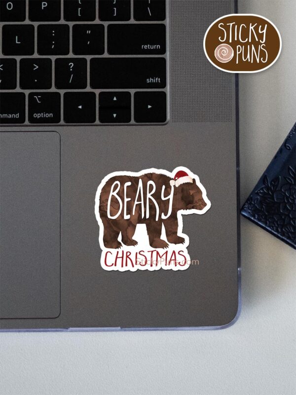 beary christmas pun sticker shown stuck on a laptop