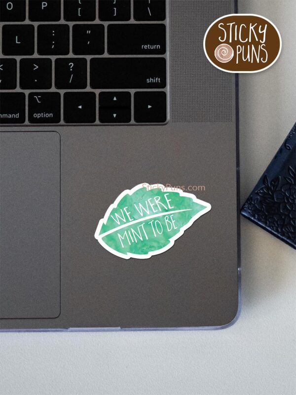 we were mint to be pun sticker shown stuck on a laptop
